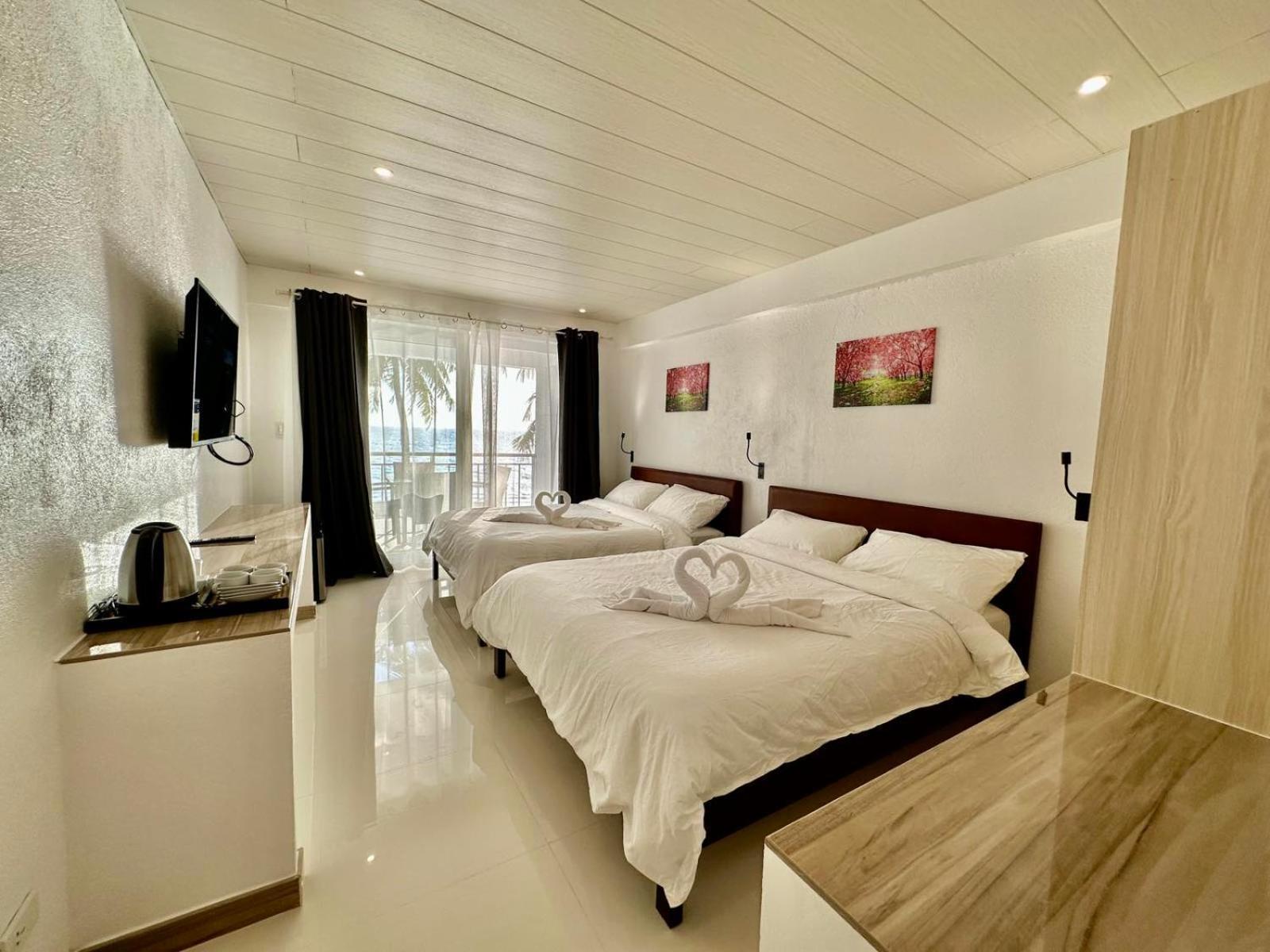 Calypso Beach And Dive Resort Manoc-Manoc Bagian luar foto
